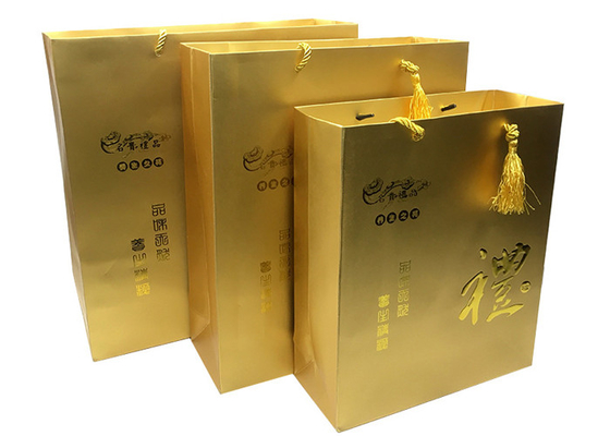acheter Sacs imprimés de luxe faits sur commande de cadeau de papier d'or avec les poignées de relief de Logo Tassel online manufacture