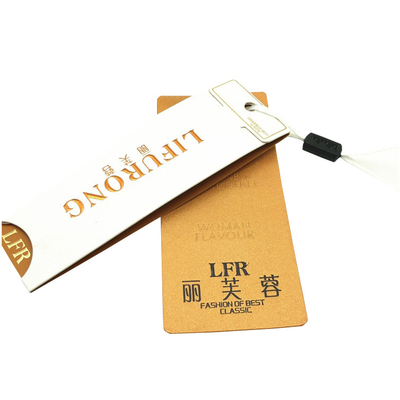 Un bon prix. Les étiquettes de papier d'oscillation de marque d'habillement de luxe fait sur commande gravent la feuille d'or en refief emboutissant le logo en ligne